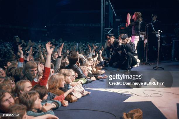 The Rolling Stones concert in 1970 - Mick Jagger and his fans.