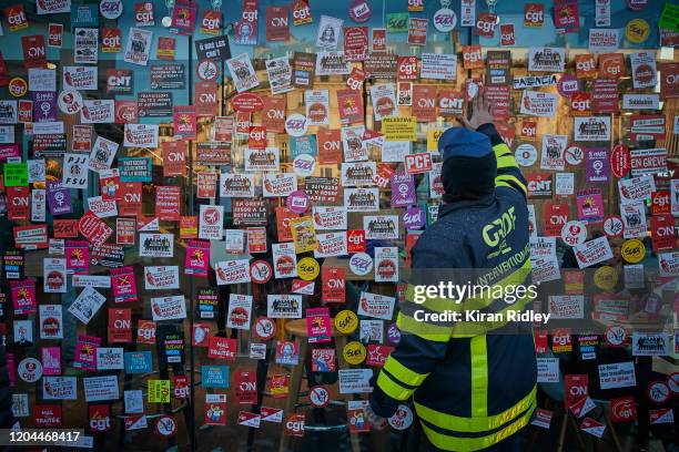 McDonalds is plastered with Union stcikers as thousands march through the streets of Paris on the 9th inter-professional day of strikes and...