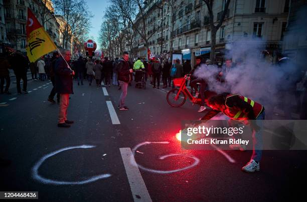 Union members march through Paris on the 9th inter-professional day of strikes and demonstration against President Macron’s controversial pension...