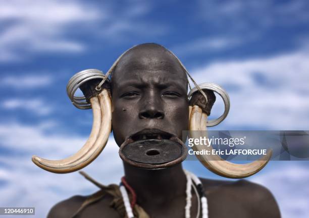 Mursi woman in Omo valley in Ethiopia on October 25, 2008 - Mursi can be found in the land between the Omo and Mago rivers. Neighboured by the Burma,...