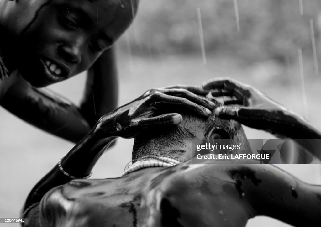 Kid From Karo Tribe Washing Under The Rain In Korcho Village In Ethiopia On October 29, 2008 -