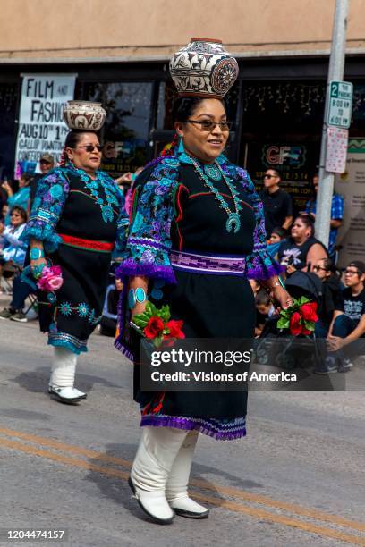 Zuni women with Indian Pots on head march 98th Gallup Inter-tribal Indian Ceremonial, New Mexico.