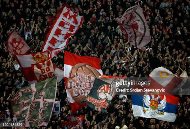 Delije fans of Crvena Zvezda show their support during the Super Liga match between FK Crvena Zvezda and FK Partizan at Stadium Rajko Mitic on March...