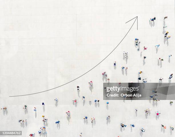 crowd from above forming a growth graph - elevated view of person on white background stock pictures, royalty-free photos & images