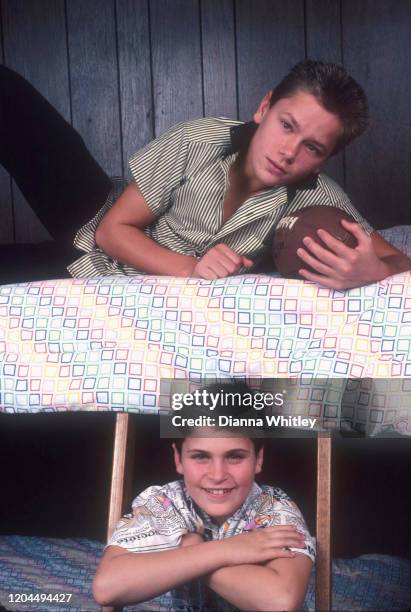 American actors Joaquin and River Phoenix in the bunk bed they shared at their home in Los Angeles, California, US, circa 1985.