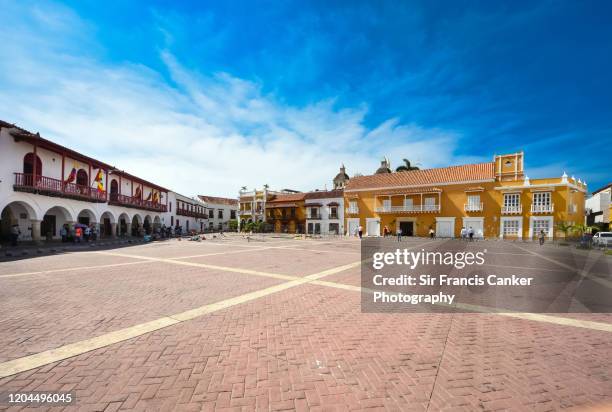 "plaza de la aduana" square in cartagena de indias with city town hall on left hand side, colombia - market square stock pictures, royalty-free photos & images