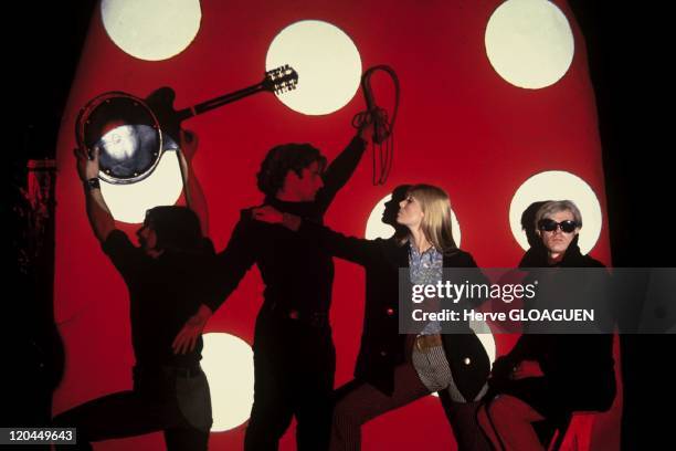 American pop artist Andy Warhol with his associate Gerard Malanga and members of the Velvet Underground, New York City, circa 1966. Left to right:...