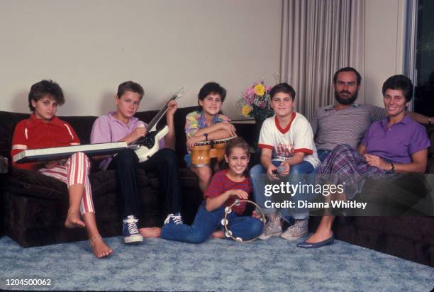 The Phoenix Family relaxing at their home in Los Angeles, California, US, circa 1985; L-R Liberty Phoenix, River Phoenix, Rain Phoenix, Summer...