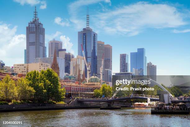 day view of yarra river and melbourne skyscrapers business office building with evening skyline in victoria, australia. australia tourism, modern city life, or business finance and economy concept - southbank imagens e fotografias de stock