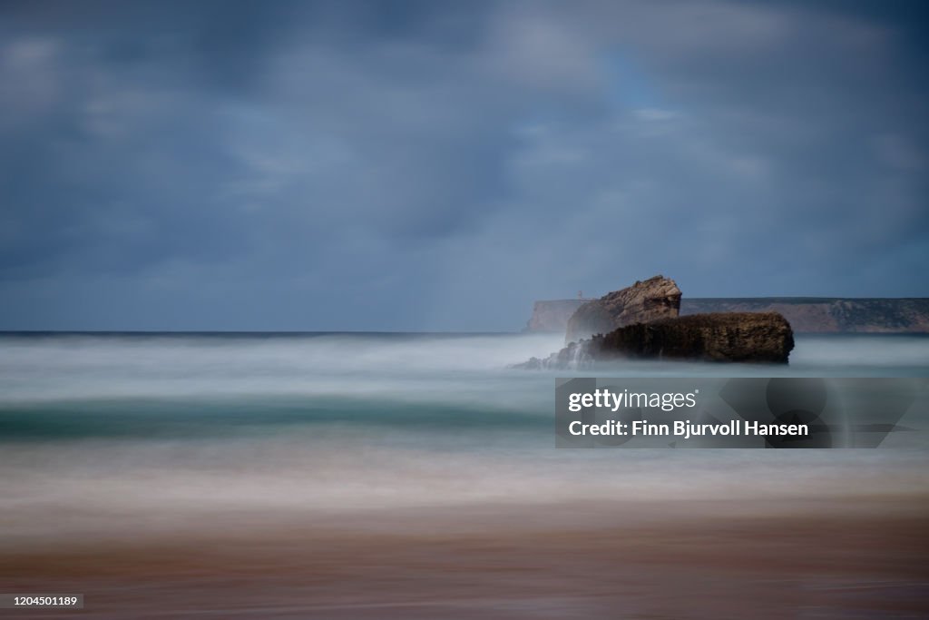 Beach of Sagres on the Algarve coast in Portugal - Caboo Sao Vicente in the background