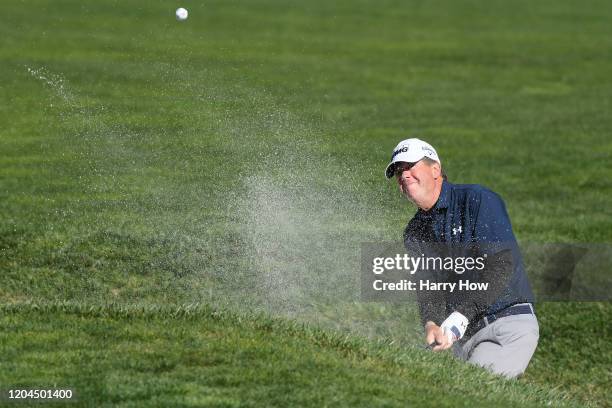 Scott McNealy plays a shot from a bunker on the 17th hole during the during the first round of the AT&T Pebble Beach Pro-Am at Pebble Beach Golf...