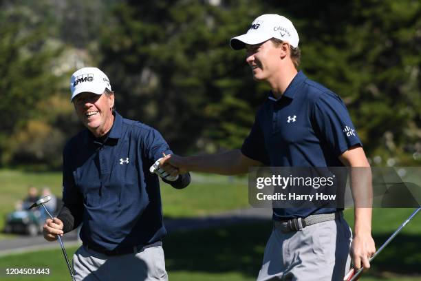 Scott McNealy celebrates his putt with his son, Maverick McNealy on the 16th green during the during the first round of the AT&T Pebble Beach Pro-Am...