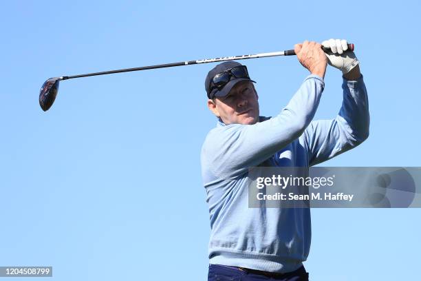 Owner Jim Crane of the Houston Astros plays his shot from the sixth tee during the during the first round of the AT&T Pebble Beach Pro-Am at Spyglass...