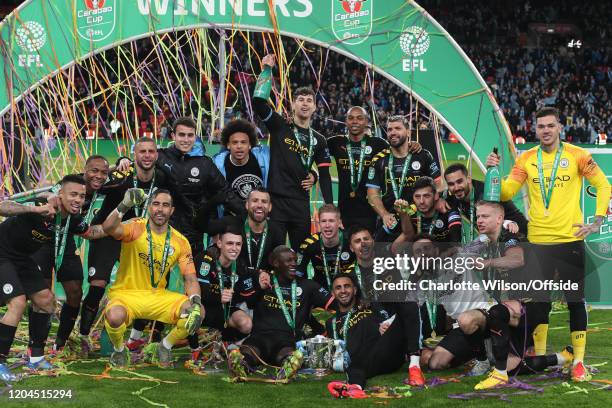 Man City celebrate winning the trophy during the Carabao Cup Final between Aston Villa and Manchester City at Wembley Stadium on March 1, 2020 in...