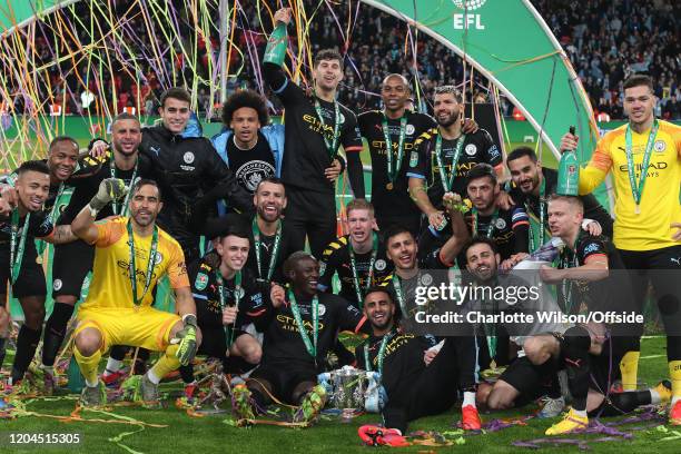 Man City celebrate winning the trophy during the Carabao Cup Final between Aston Villa and Manchester City at Wembley Stadium on March 1, 2020 in...