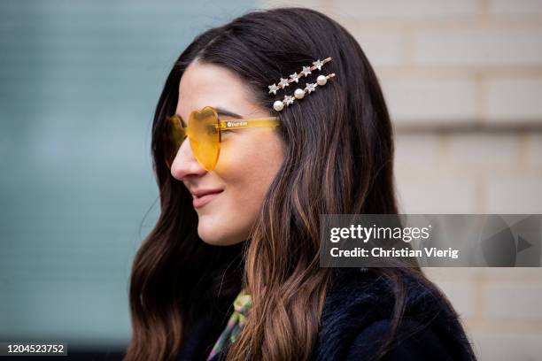 Guest is seen wearing sunglasses, hair clip outside Tadashi Shoji during New York Fashion Week February 2020 on February 06, 2020 in New York City.