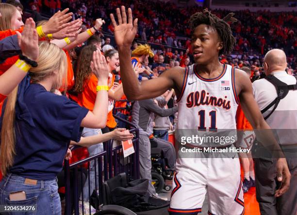 Ayo Dosunmu of the Illinois Fighting Illini celebrates with fans after the game against the Indiana Hoosiers at State Farm Center on March 1, 2020 in...