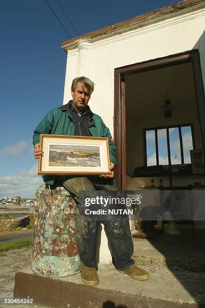 Tory Island, Ireland in 2004 - Painter Anton Mehan in front of Tory's gallery.