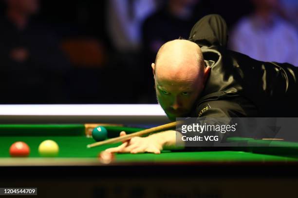 Gary Wilson of England plays a shot during the quarter-final match against Tom Ford of England on day four of 2020 Coral World Grand Prix at the...