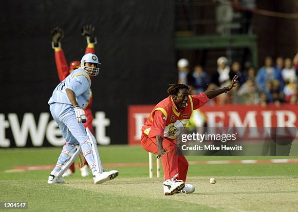 Henry Olonga of Zimbabwe traps Venkatesh Prasad of India and Zimbabwe beat India in the Cricket World Cup Group A match played in Leicester, England....