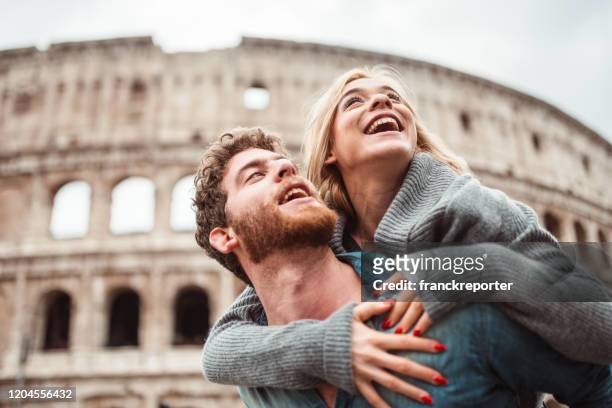 couple walking together in rome - italy winter stock pictures, royalty-free photos & images