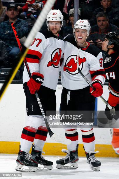 Pavel Zacha and Nikita Gusev of the New Jersey Devils celebrate Zacha's second period goal during the game against the Anaheim Ducks at Honda Center...