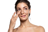 Close up portrait of woman apply face skin scrub