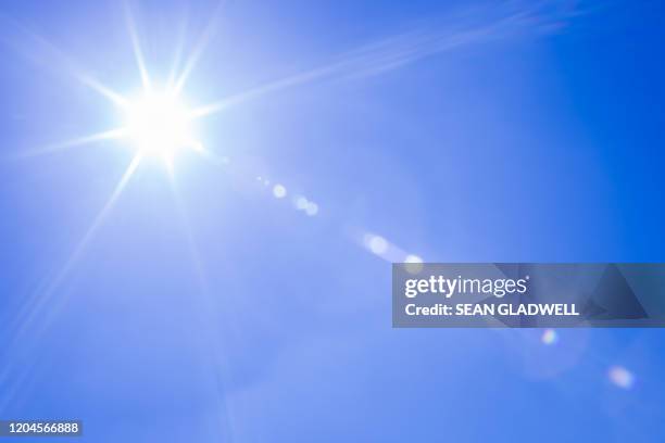 sunshine lens flare - lense flare stock-fotos und bilder