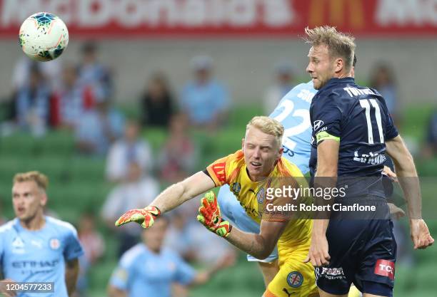 Melbourne City goalkeeper Tom Glover gets the ball away from Ola Toivonen of the Victory during the round 18 A-League match between Melbourne City...