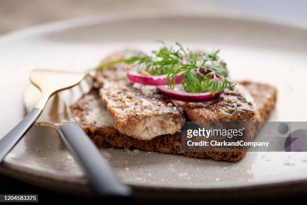 pan fried herring or sild smorrebrod - rye bread stock pictures, royalty-free photos & images