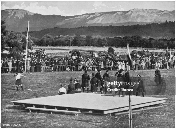 antique photograph of the british empire: highland games - scottish highland games stock illustrations