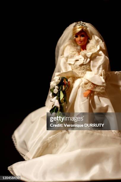 Barbie celebrates her 50th anniversary, Claude Brabant with her 300 Barbie dolls in Paris, France on February 02, 2009 - Costume of the bridal-dress...