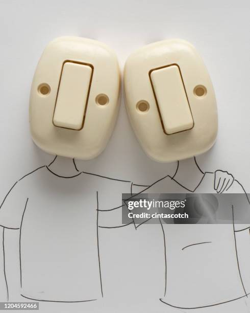 conceptual couple with their arms around each other - schalter stock-fotos und bilder