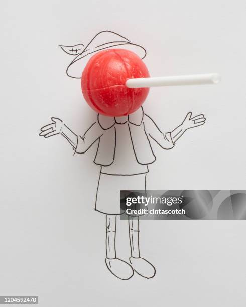 conceptual boy with a long nose - pinocchio stock-fotos und bilder