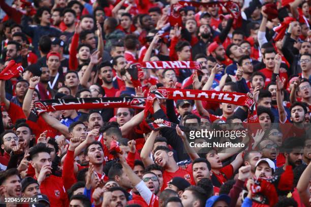 Al Ahly fans cheer before the CAF Champions League quarterfinal first-leg soccer match between Al-Ahly and Mamelodi Sundowns at Cairo Stadium in...