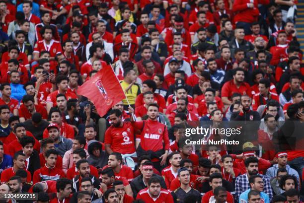 Al Ahly fans cheer before the CAF Champions League quarterfinal first-leg soccer match between Al-Ahly and Mamelodi Sundowns at Cairo Stadium in...