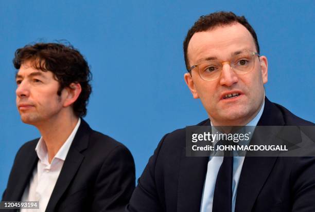 German Health Minister Jens Spahn and Christian Drosten, director of the Institute of Virology at Berlin's Charite hospital, address a press...