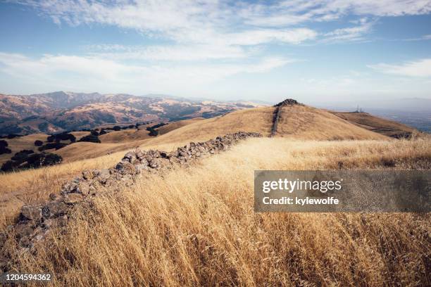 boundary wall between two park districts, mission peak, fremont, california, usa - east bay regional park stock pictures, royalty-free photos & images