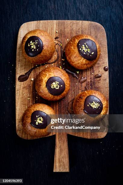 traditional old fashioned fastelavnboller or danish cream cakes - danish pastry stock pictures, royalty-free photos & images