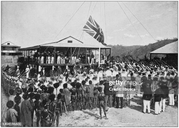 ilustraciones, imágenes clip art, dibujos animados e iconos de stock de fotografía antigua del imperio británico: izar la bandera británica en port moresby, nueva guinea - imperio británico