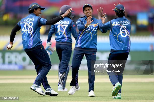 Sri Lanka players congratulate Shashikala Siriwardena of after she took 4/16 during the Sri Lanka v Bangladesh Women's T20 Cricket World Cup match at...