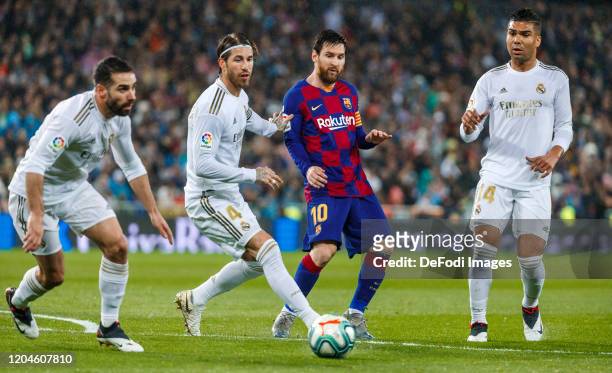 Carlos Henrique Casemiro, Sergio Ramos and Daniel Carvajal of Real Madrid, Lionel Messi of FC Barcelona battle for the ball during the Liga match...