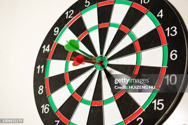 dart board with two arrows - dart board stock pictures, royalty-free photos & images