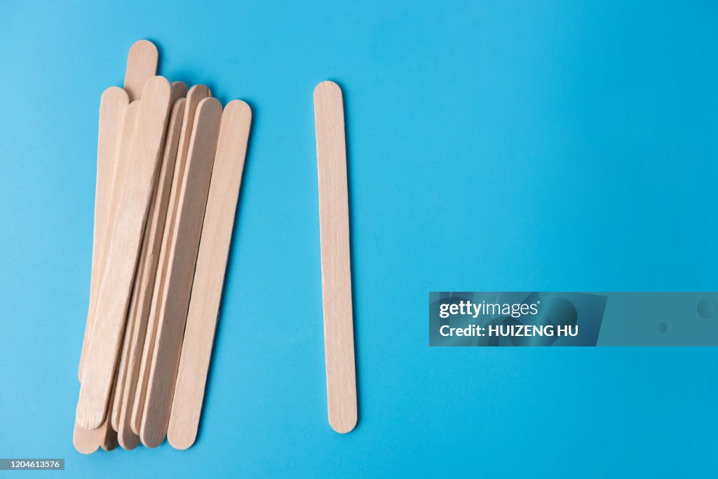 Ice cream sticks on blue background