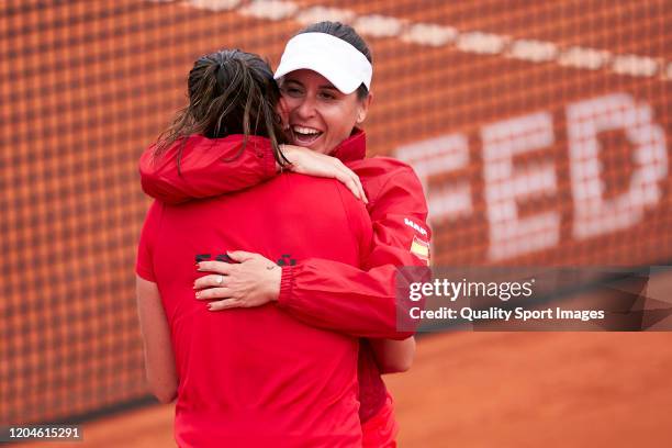 Sara Sorribes of Spain celebrates with Anabel Medina, Captain of Spain after winning her match against Naomi Osaka of Japan during the 2020 Fed Cup...