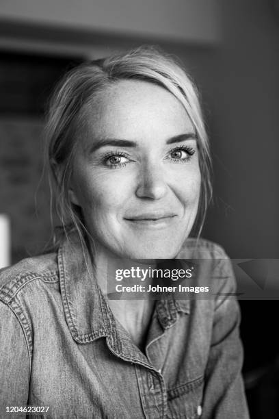 smiling woman looking at camera - black and white portrait woman stock pictures, royalty-free photos & images