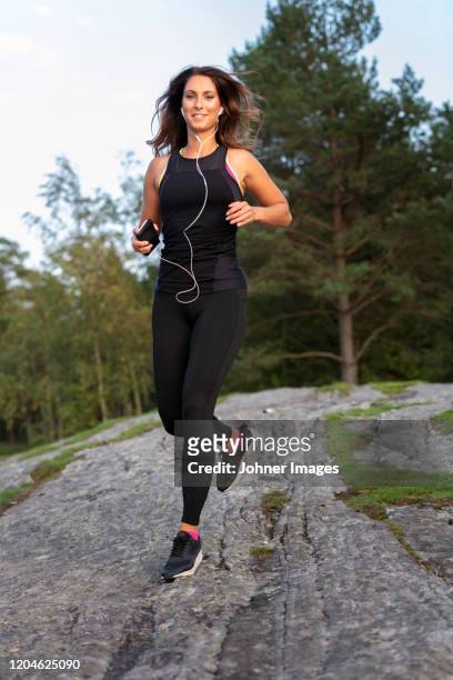 woman jogging outside - johner images bildbanksfoton och bilder
