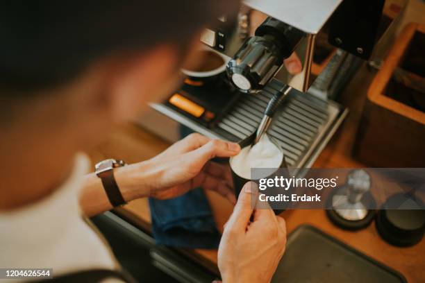 barista with milk froth for latte art at cafe - steam machine stock pictures, royalty-free photos & images