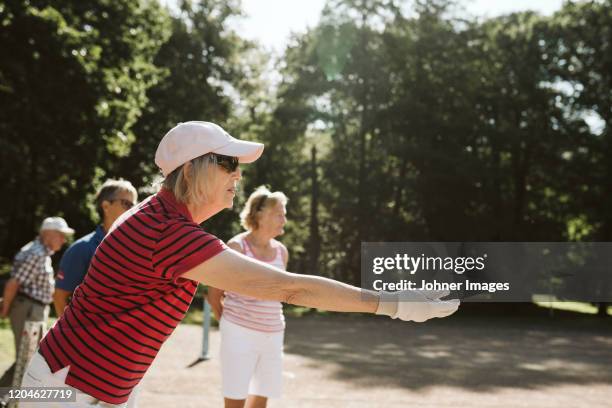 senior woman playing - boule papier stockfoto's en -beelden