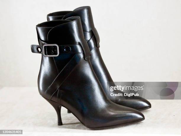 women's high heel ankle boots - booties stock pictures, royalty-free photos & images